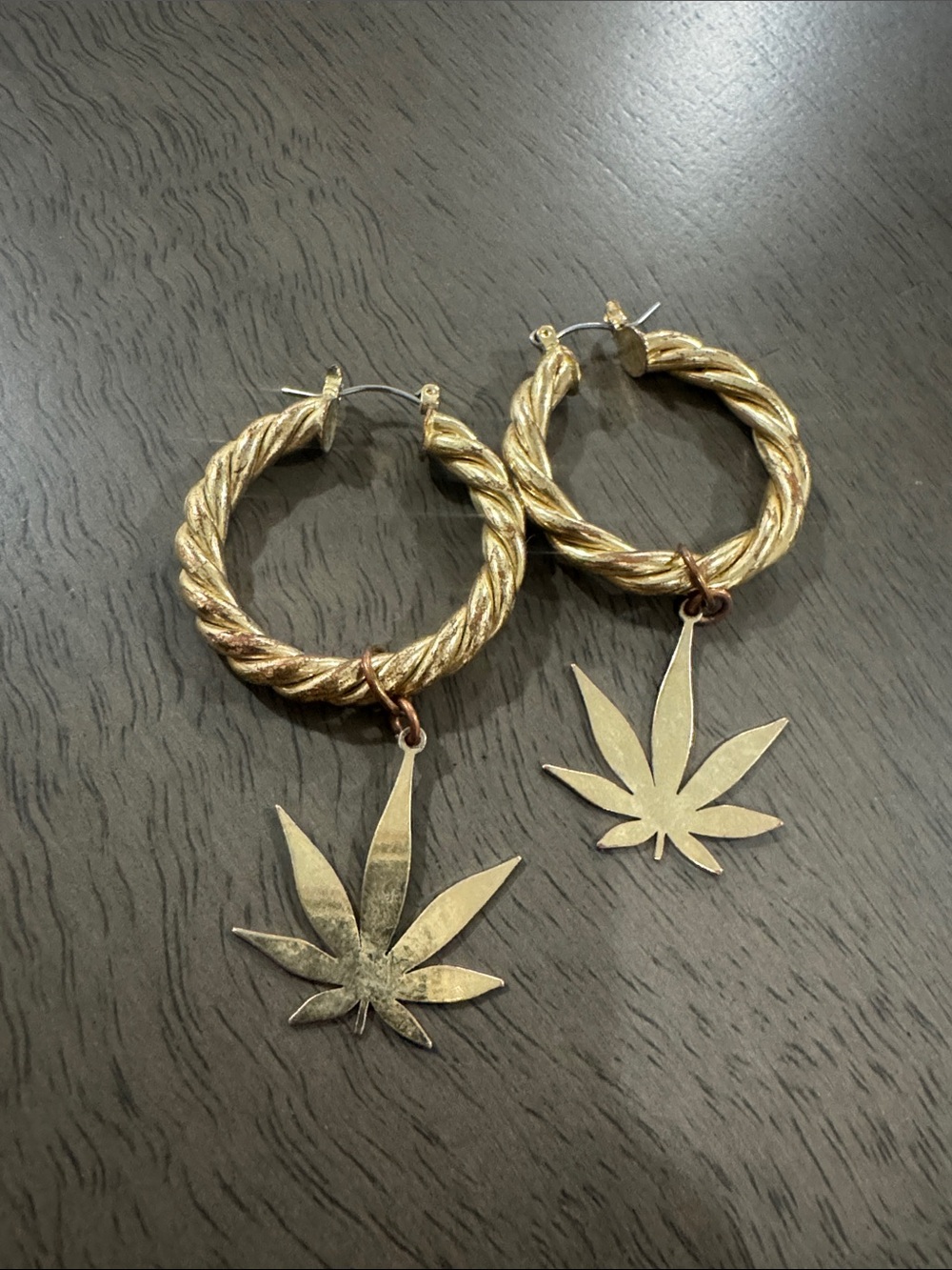 Gold-Tone Twisted Hoop Earrings with Leaf Charm
